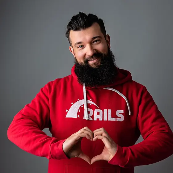 Rafał, the developer behind Uno, in a Rails hoodie